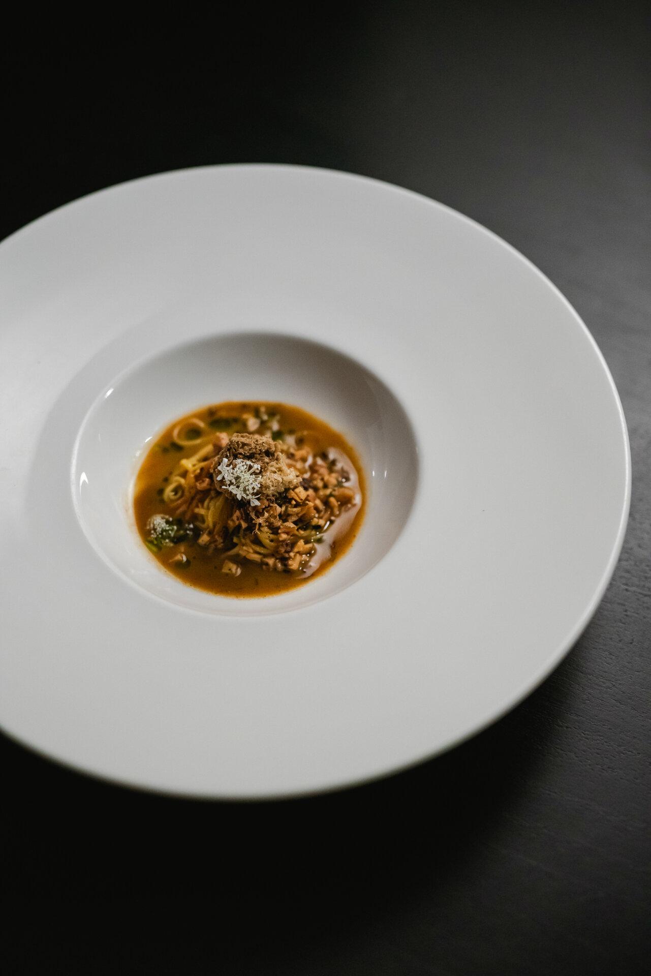 hand-cut tagliolini and mountain rabbit with cocoa nibs and truffles
