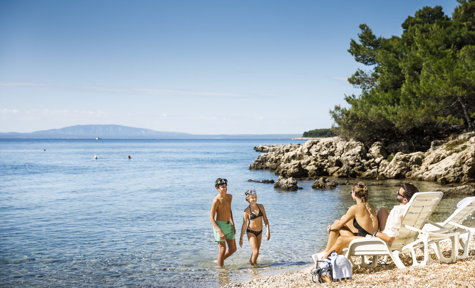 Family on a beach on Rab Island