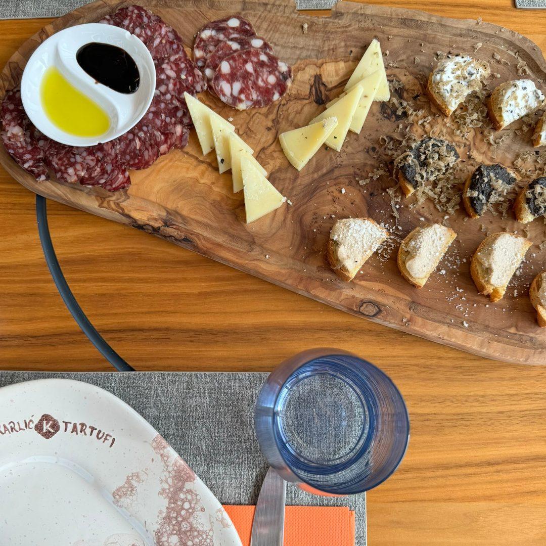 Oil, acetto balsamico, salamis and cheese with truffles.