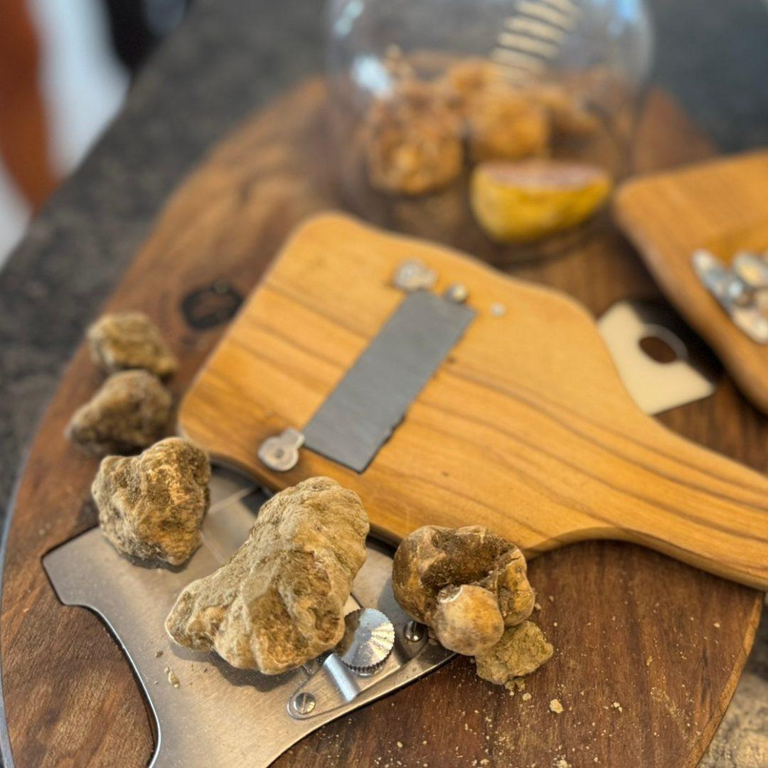 White truffles with a wooden shaver.