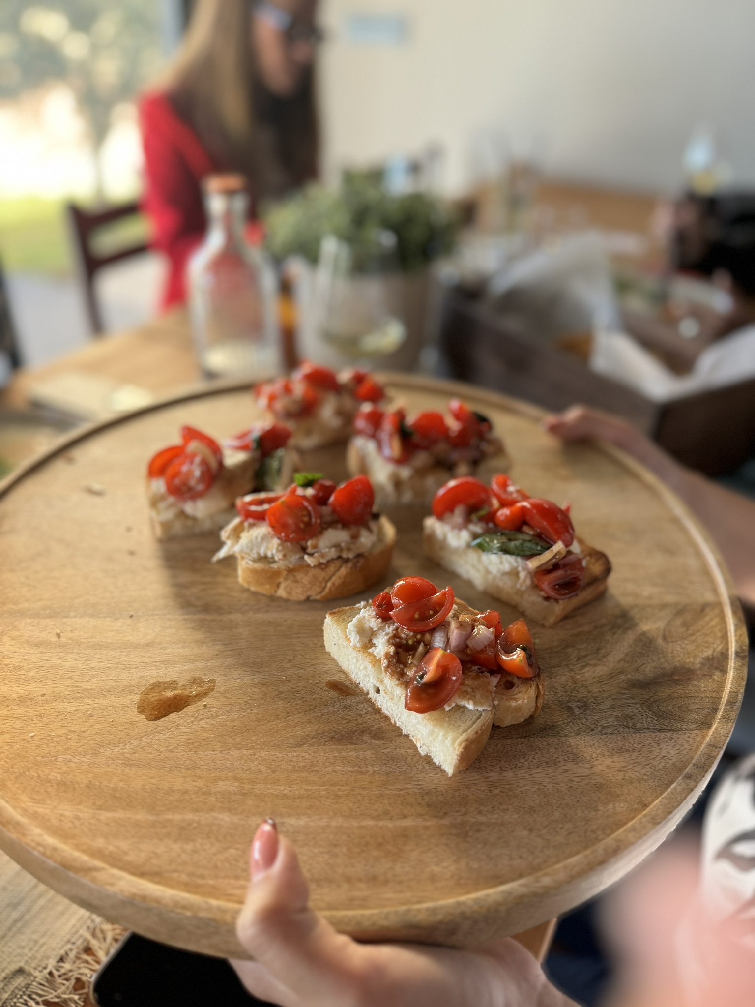 Plate with bruschettas with tomato and Forte hot sauce