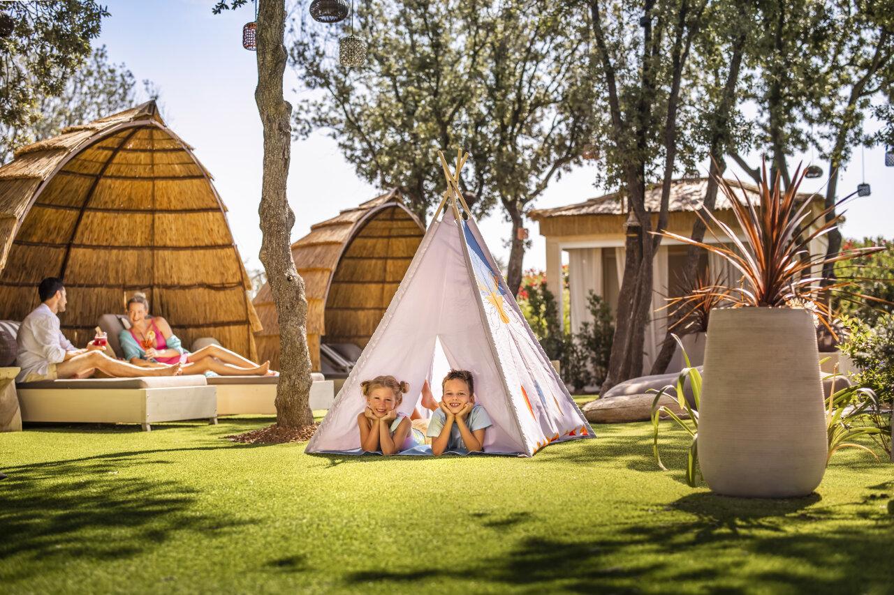 Children in a tent outside at Valamar Camping Istra