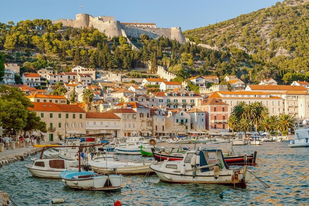 Hvar Fortress overlooking Hvar Town and the Adriatic Sea, with boats in the foreground