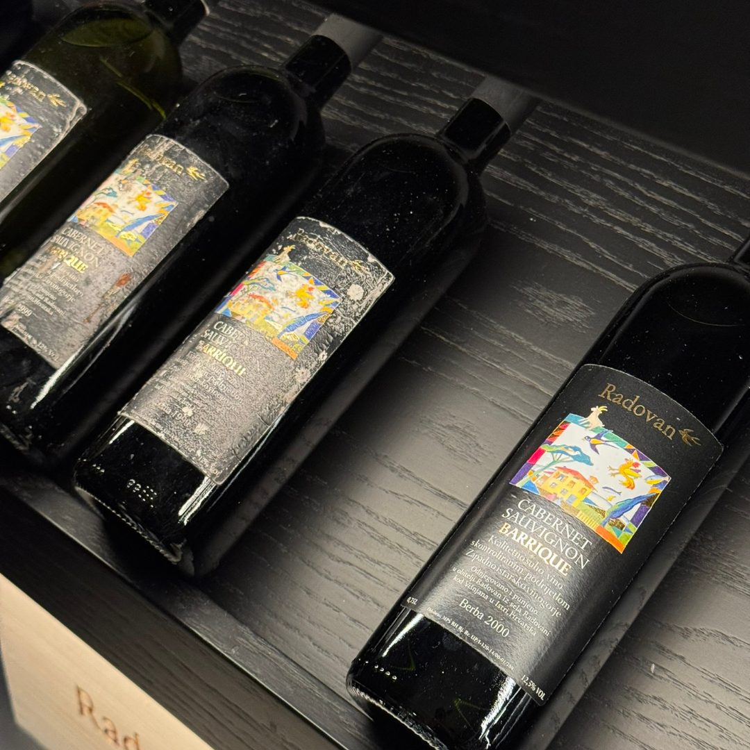 Close-up of Radovan Cabernet Sauvignon Barrique wine bottles.