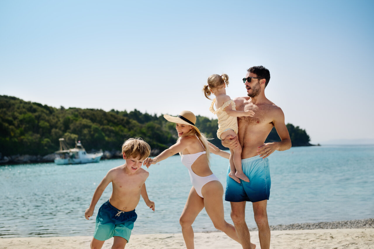 Family playing on the beach at Arba Resort in Croatia during summer