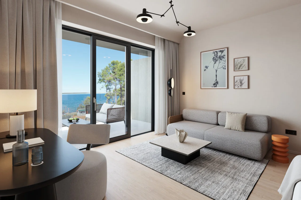 Prostrani hotelski suite s dnevnim boravkom i pogledom na more