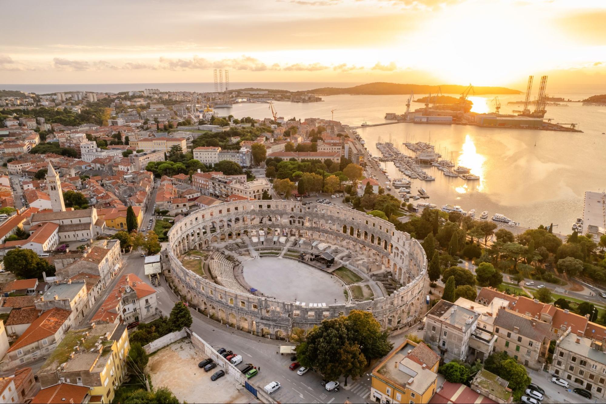 Panorama of Pula with the Arena in the foreground at sunset