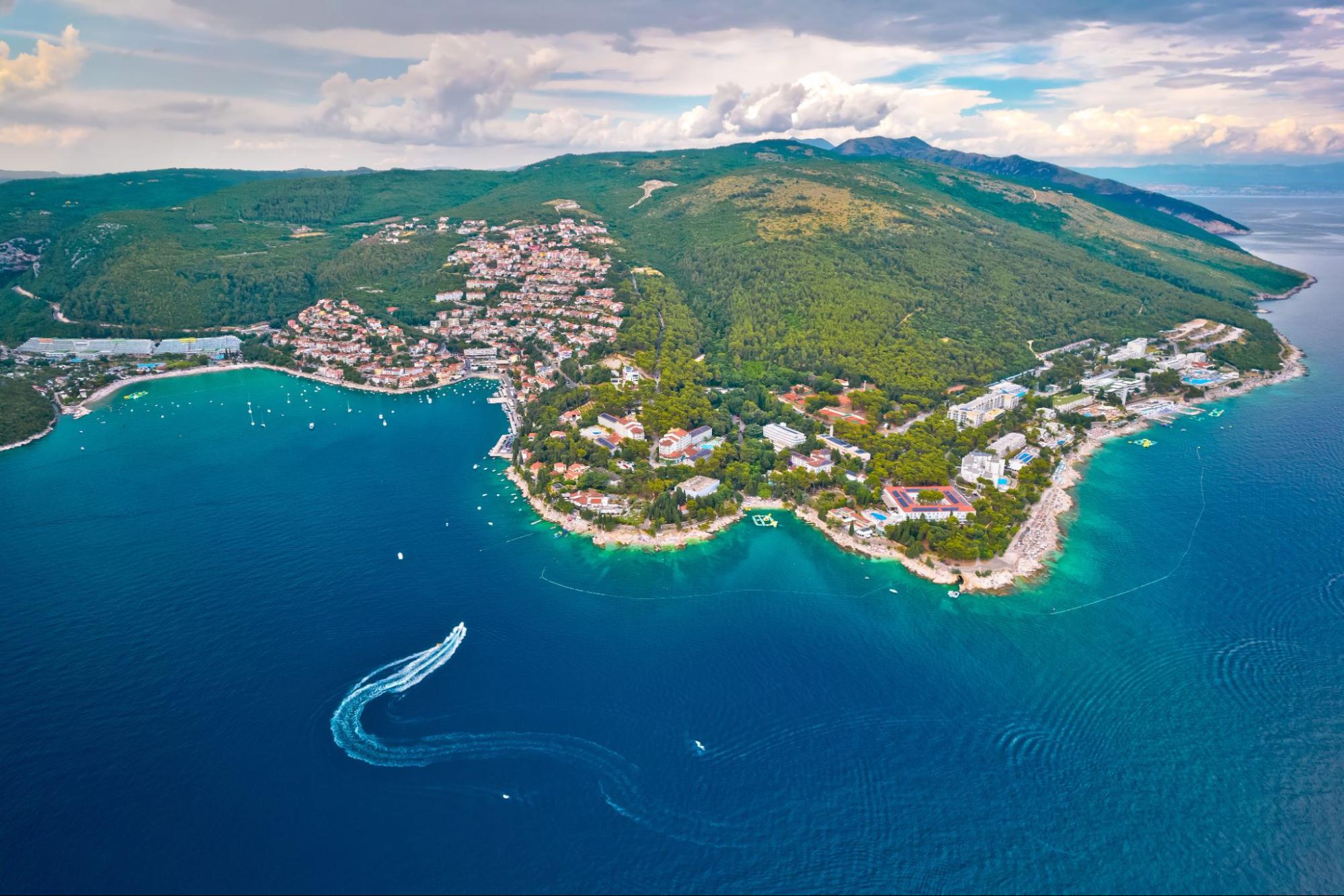 Aerial view of a bay in Rabac with turquoise sea and green hills