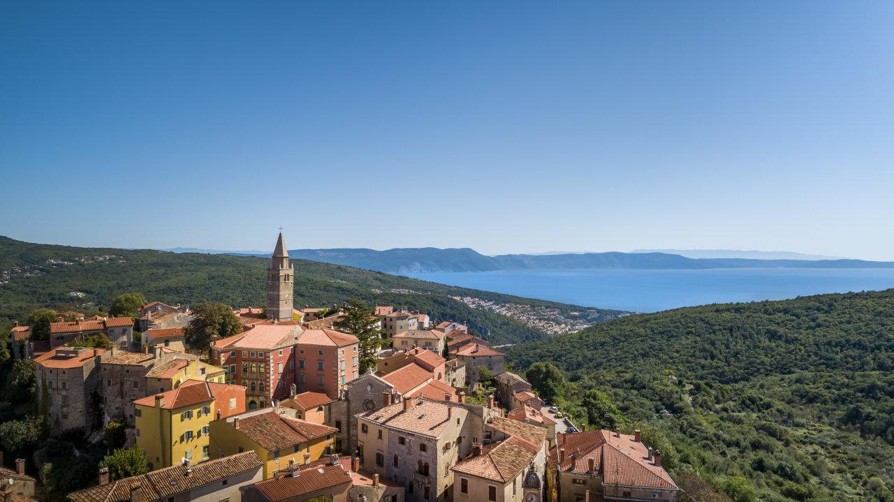 Panorama of Labin’s old town on a hill with the sea in the distance