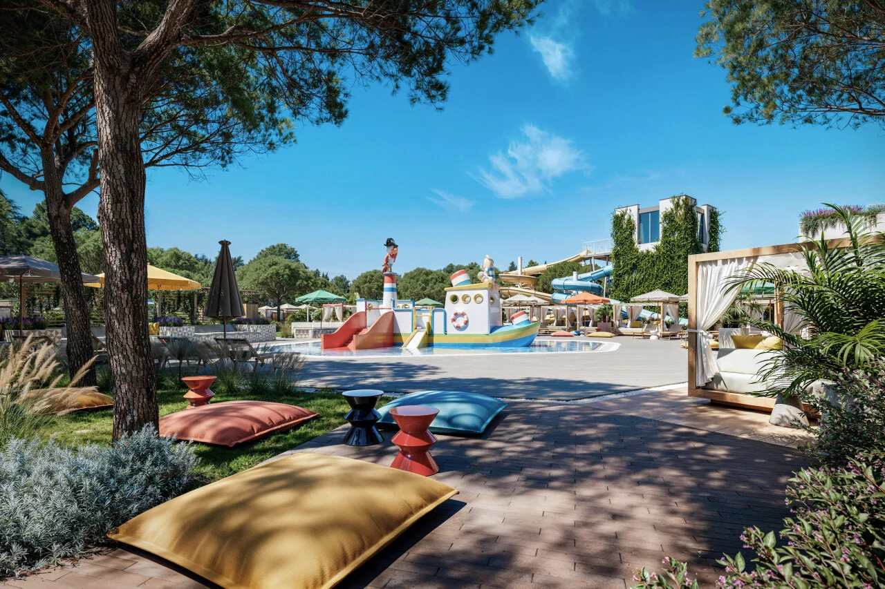 Outdoor children’s pool area at Pical Resort 5*, Valamar Collection in Poreč, featuring a colourful pirate ship splash playground, water slides, cabanas, and landscaped relaxation areas.