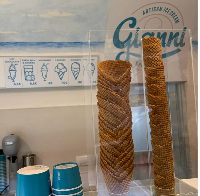 Tall towers of stacked cones and paper cups inside Gianni ice cream parlour in Dubrovnik.