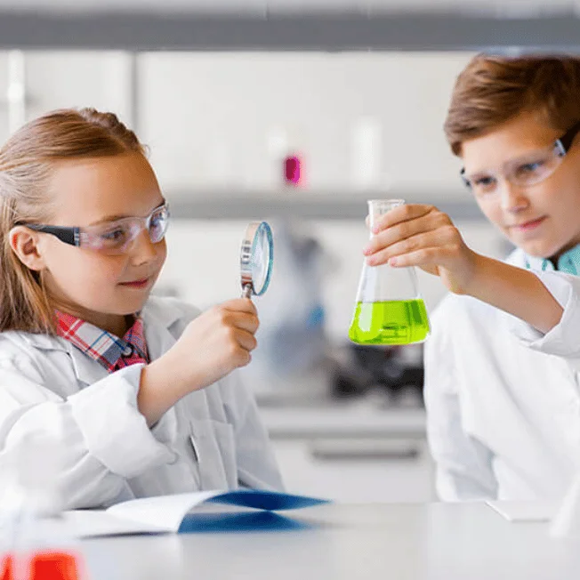  Children conducting a science experiment at Tinker Labs.
