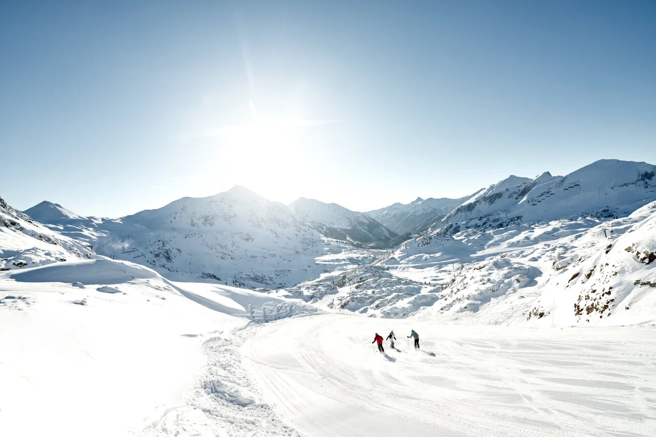 Skiers enjoying a day on the slopes in Obertauern, Austria.