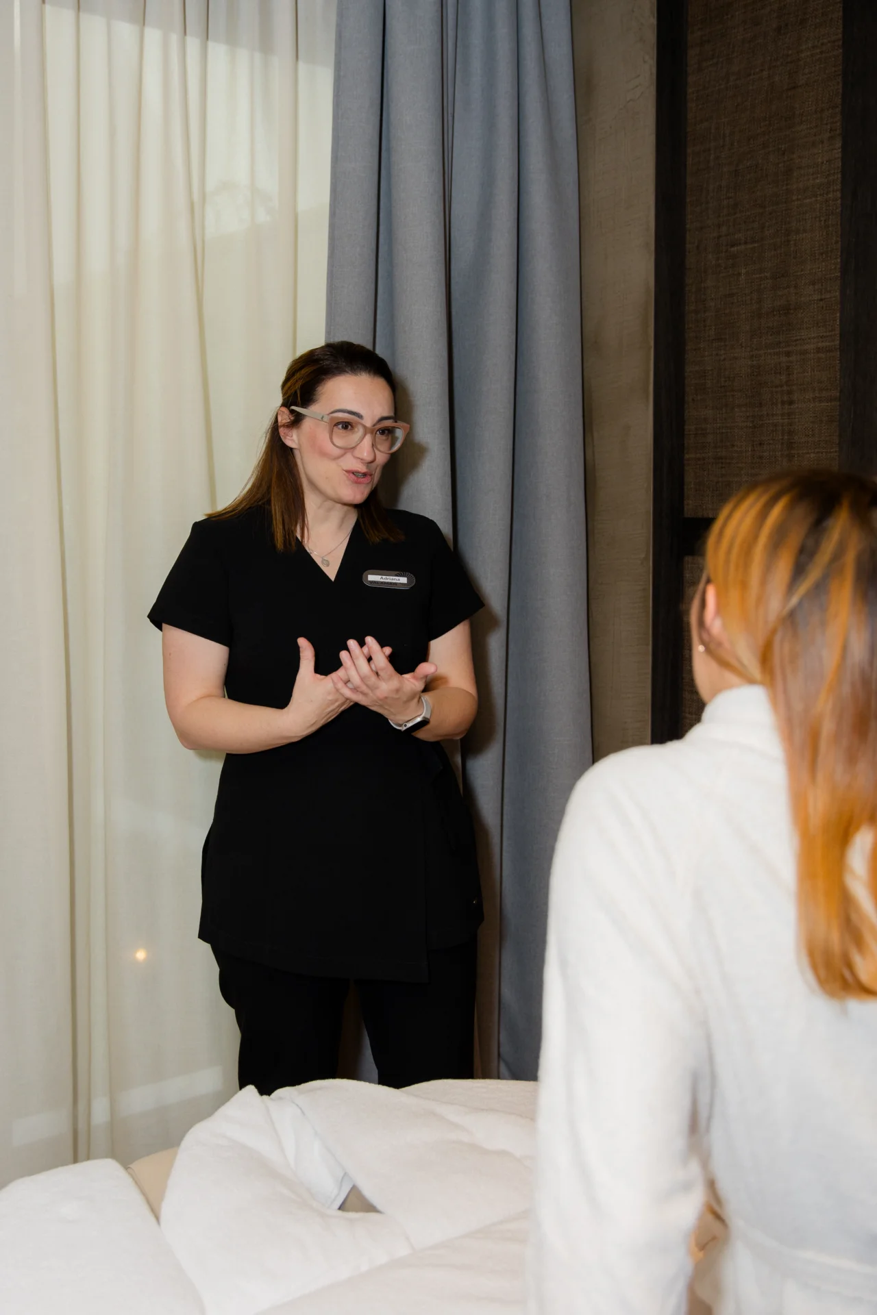 ESPA therapist consulting a guest before treatment.