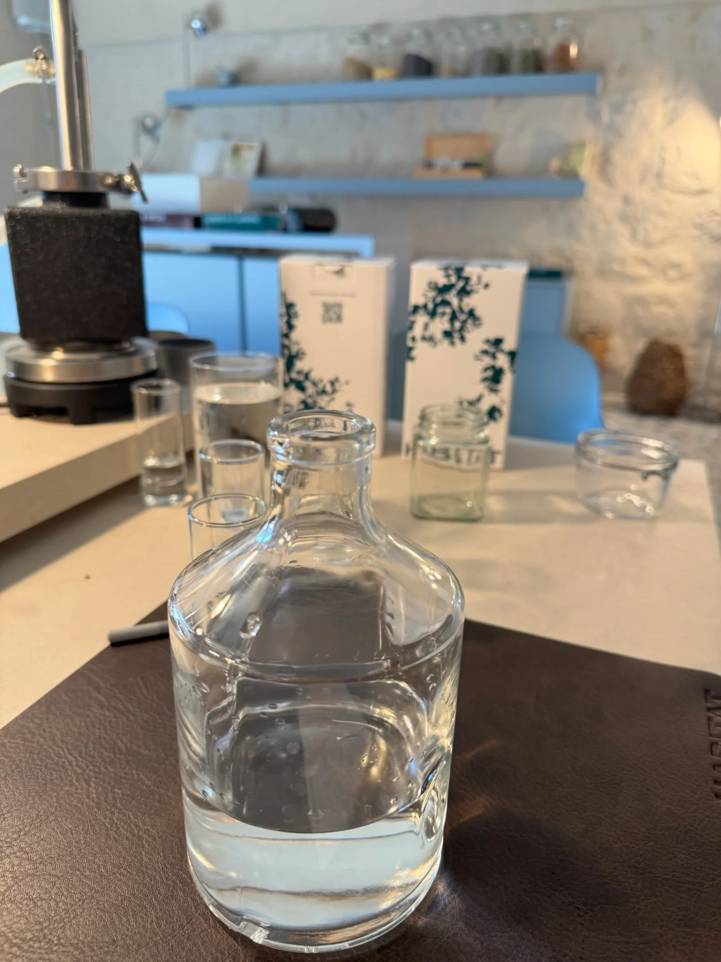 Glass bottle ready for a personalised gin during the workshop at Habitat Distillery.