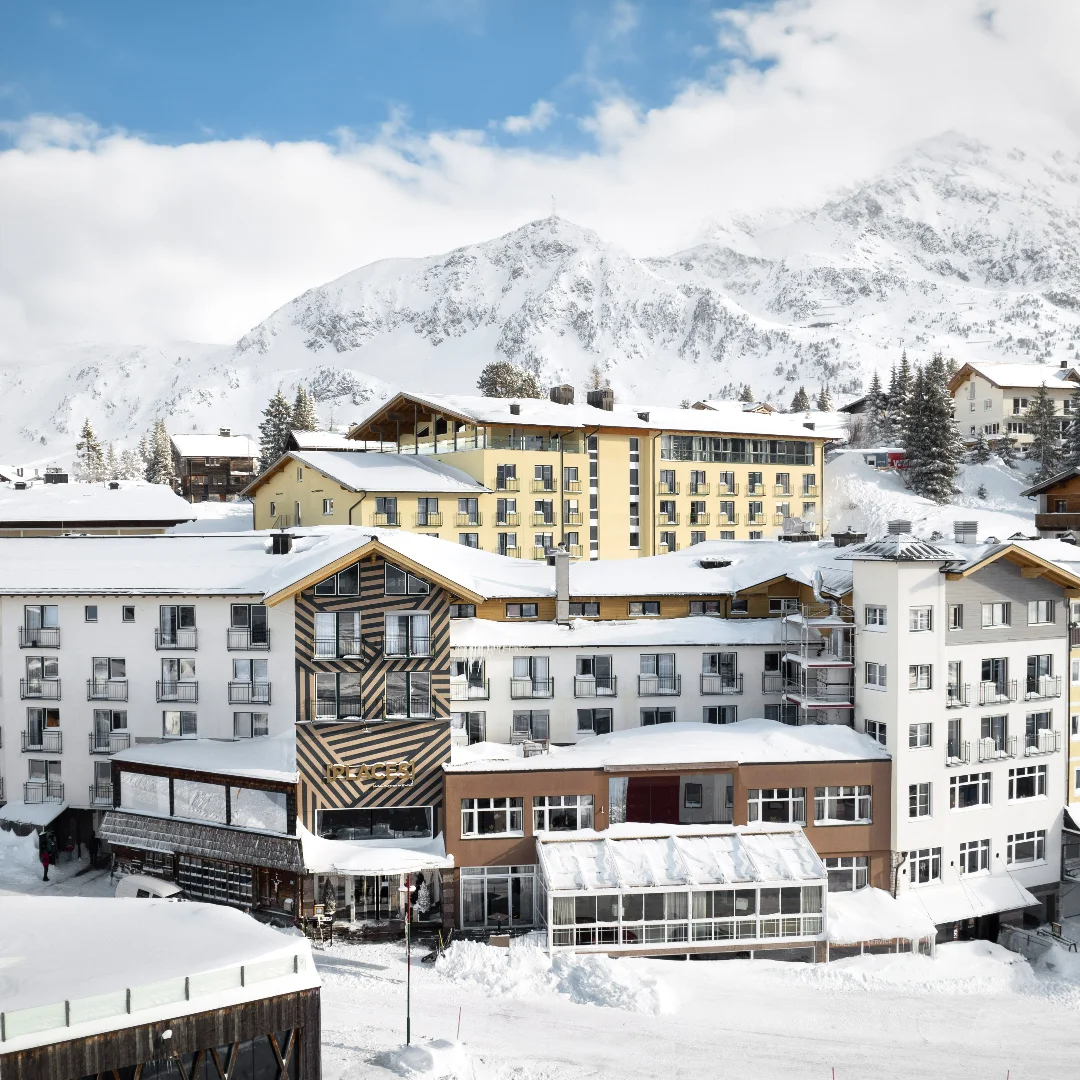 Aerial view of Places Obertauern Hotel surrounded by the snowy Austrian Alps
