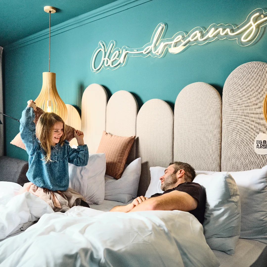 Family relaxing together in a comfortable room at Places Obertauern Hotel