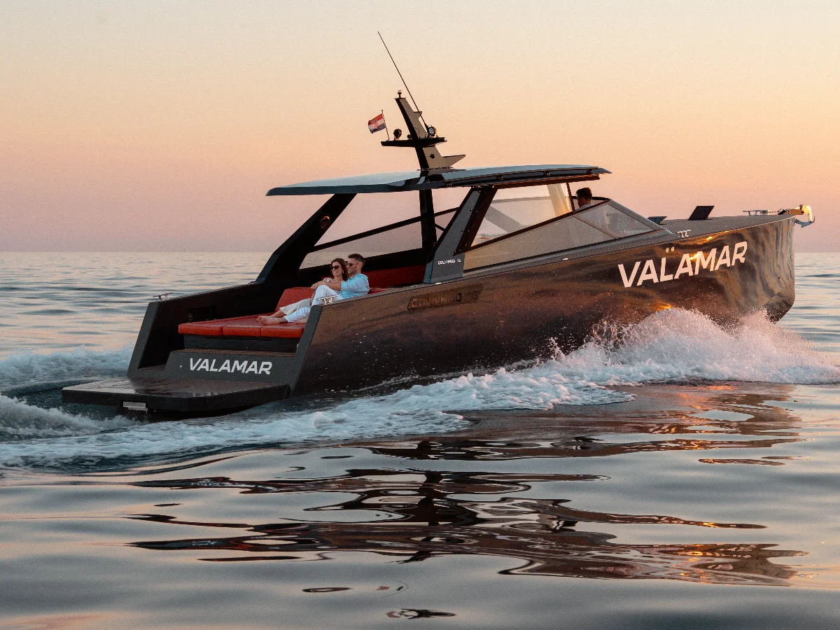 Couple enjoying a private boat trip along the Istrian coast aboard a Colnago 45.