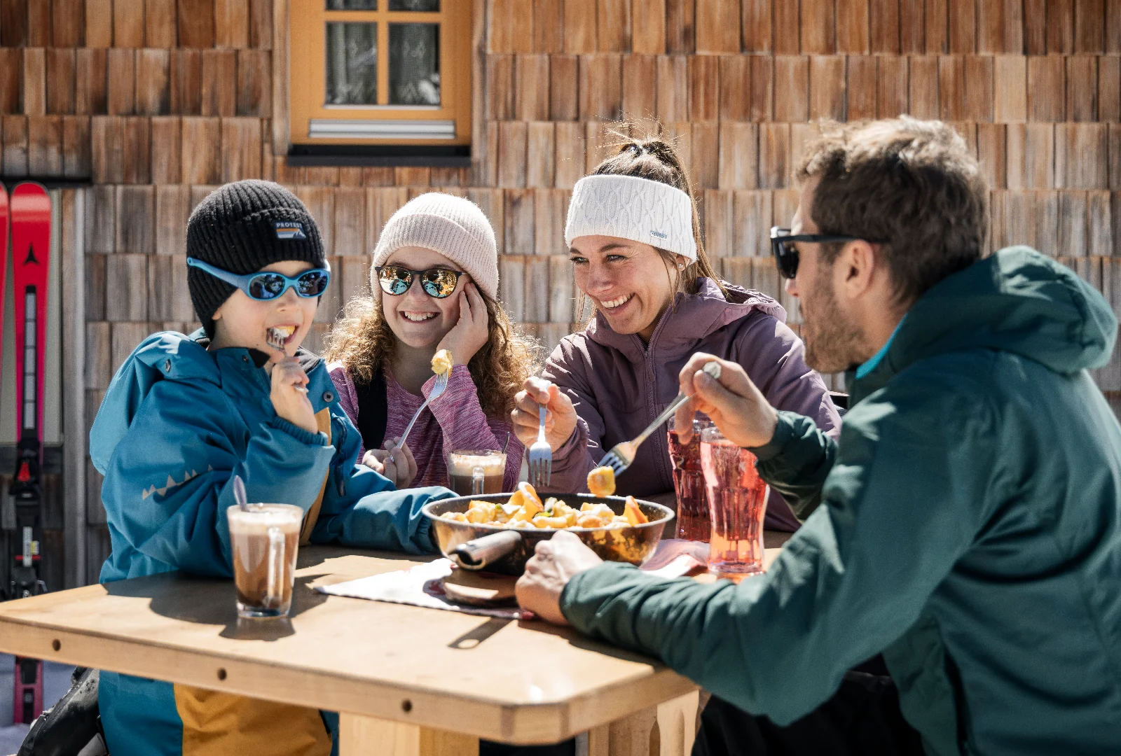 Family enjoying a break together during a ski holiday in Obertauern
