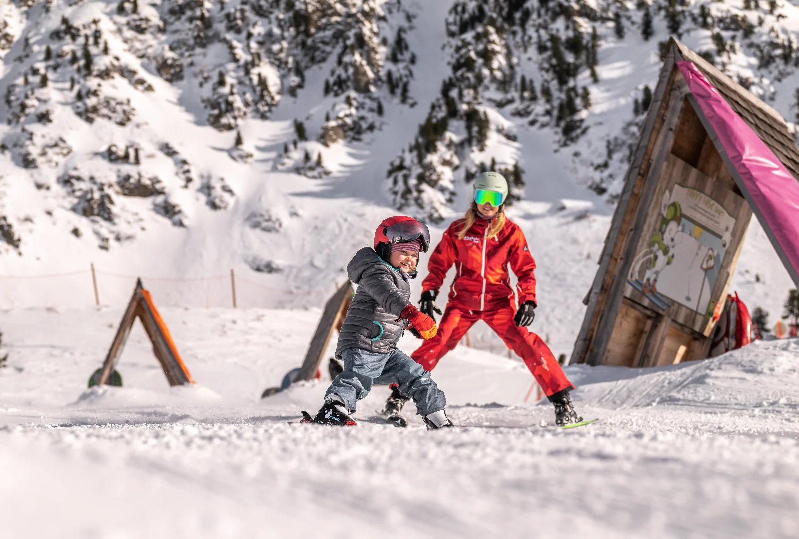 Children learning to ski with an instructor in Obertauern
