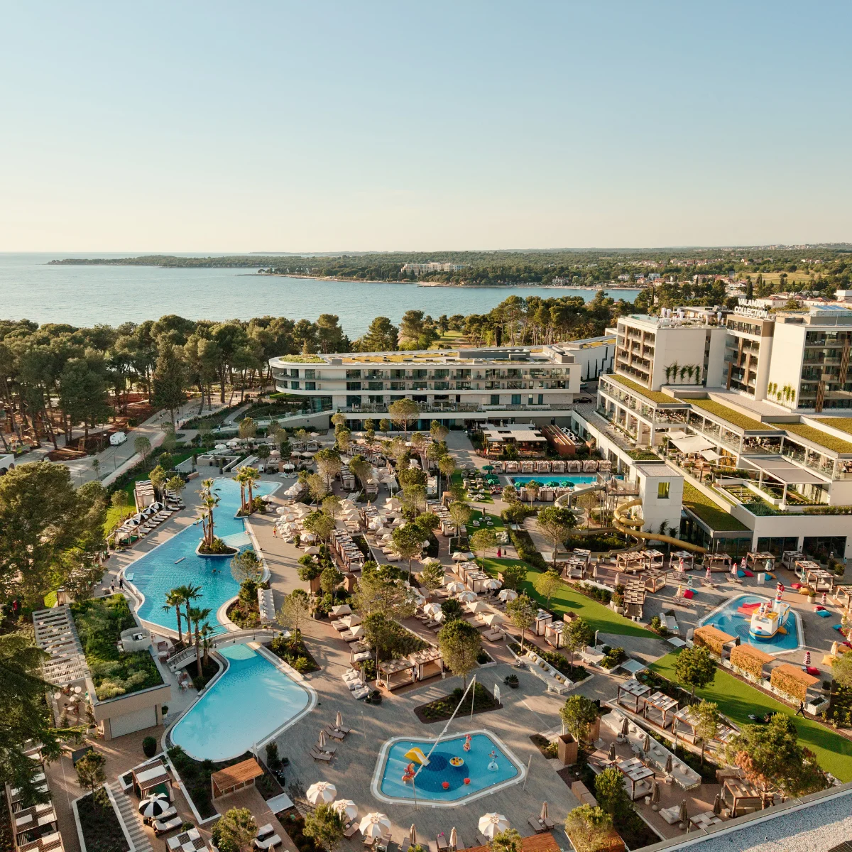 Aerial view of Pical Resort in Poreč featuring outdoor swimming pools and Adriatic coast view