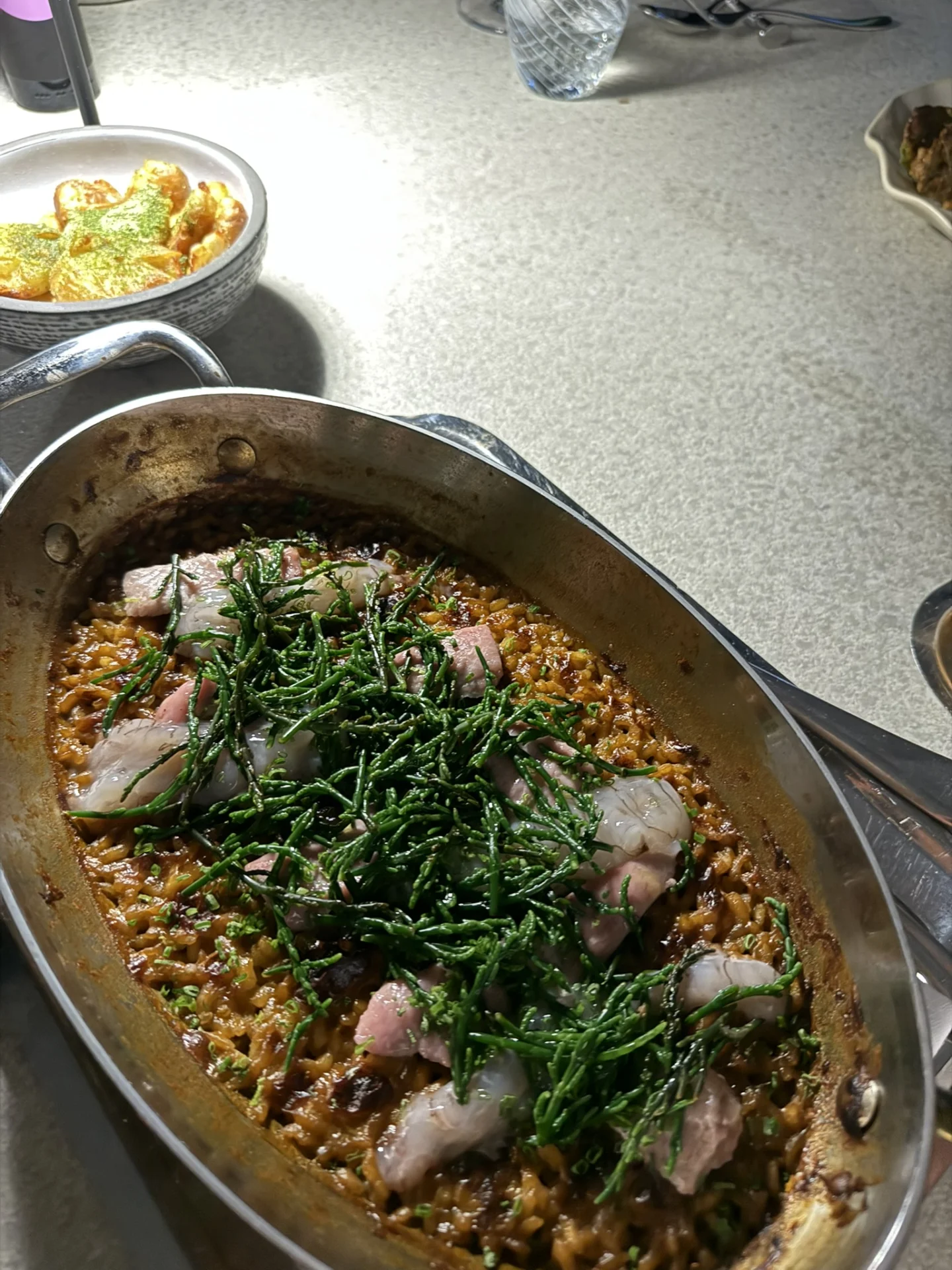  Warm seafood dish with fresh herbs served at Spinnaker Restaurant.