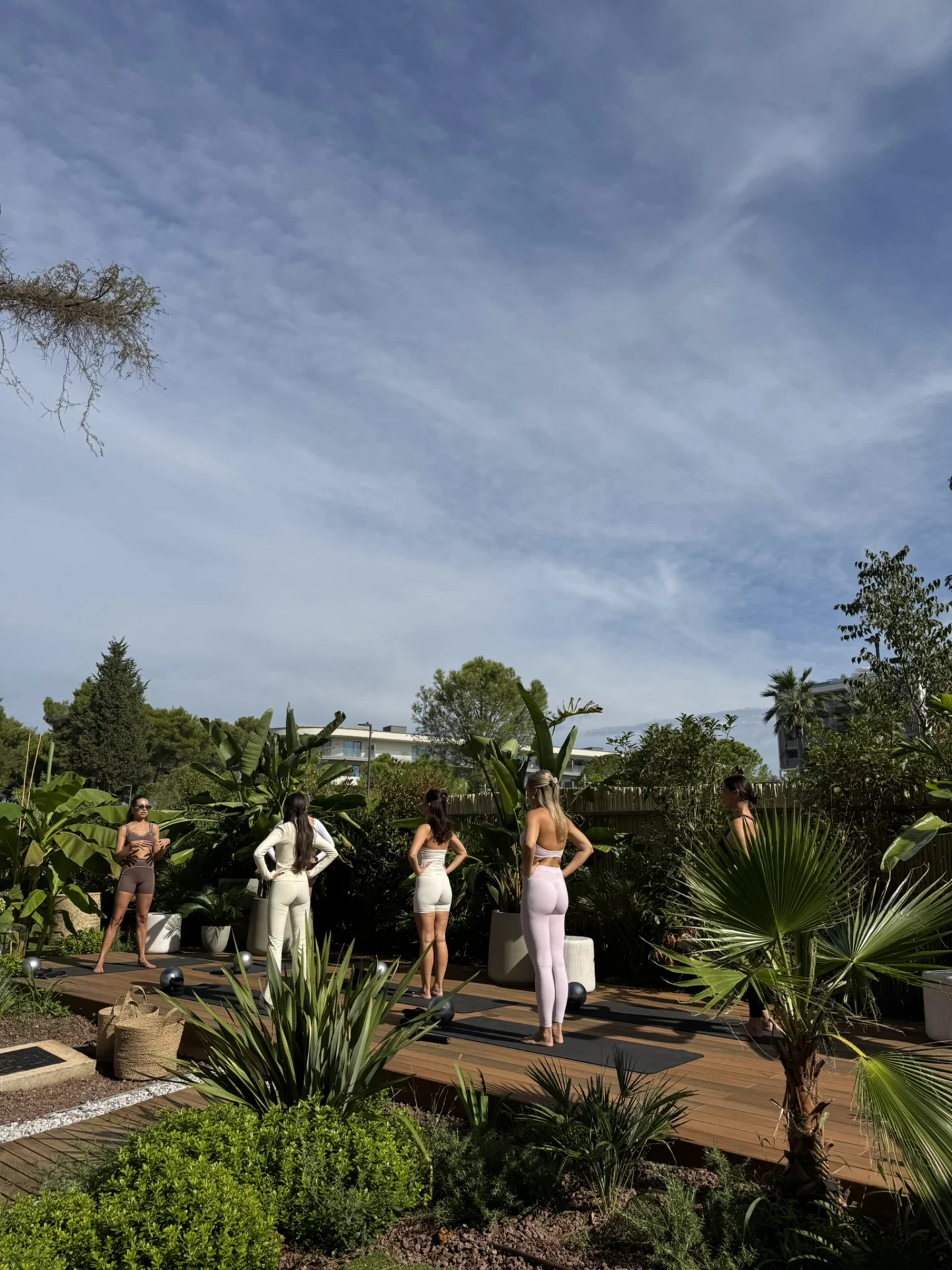  A guest doing morning yoga through the landscaped gardens at Purobeach Poreč.
