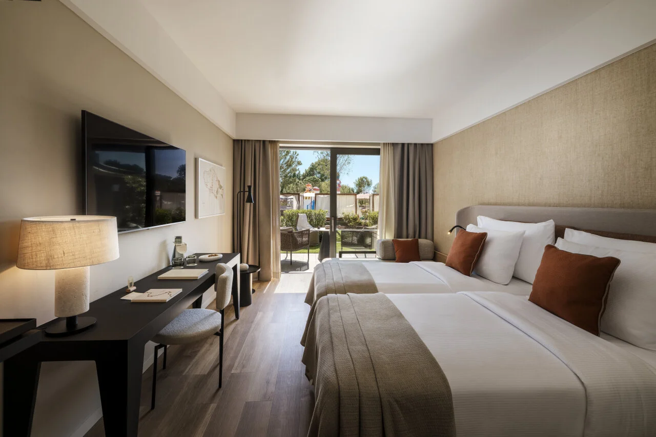 Elegantly designed hotel room at Pical Resort 5*, featuring comfortable beds, contemporary