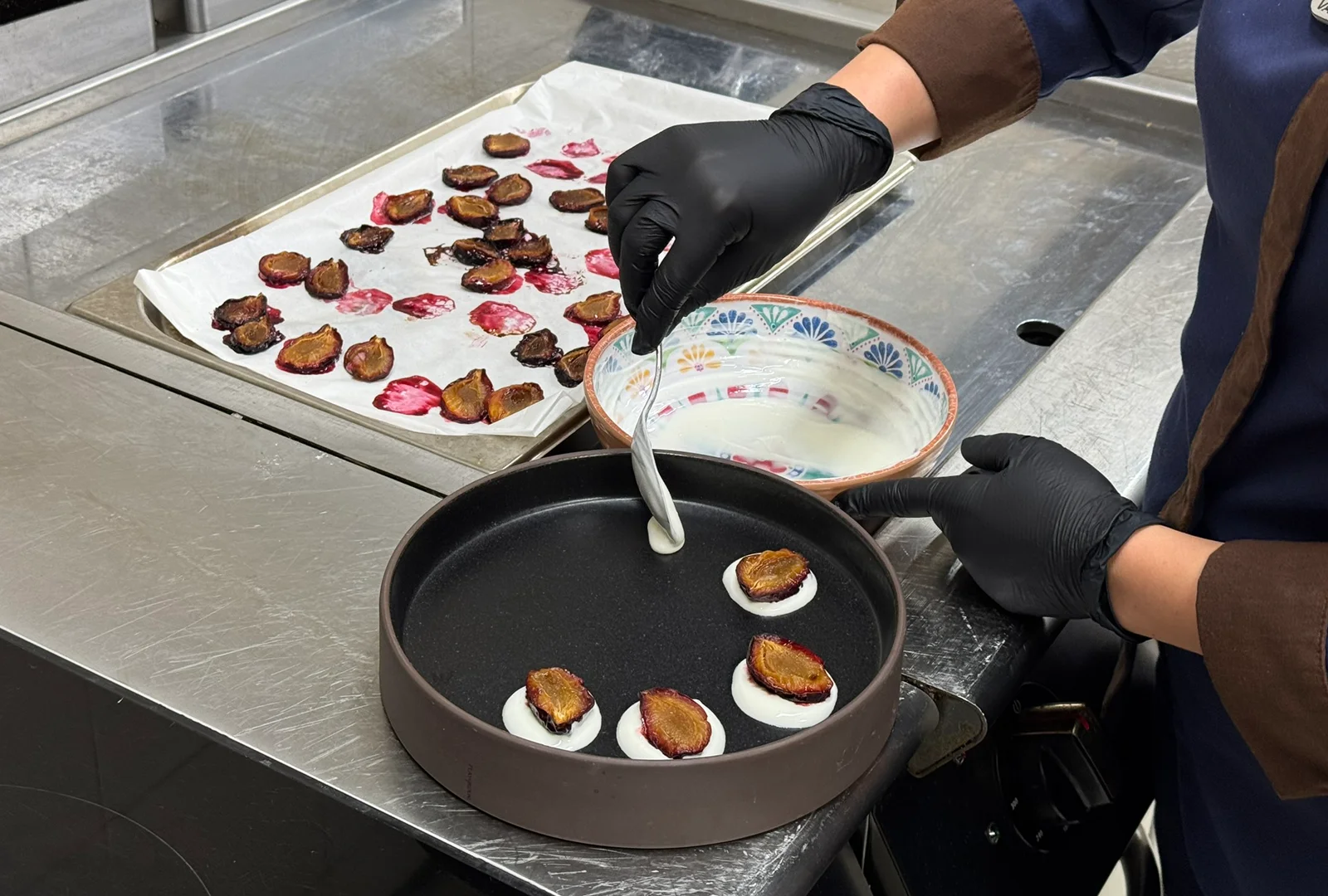 Hotel kitchen staff preparing baby meals using carefully developed recipes.
