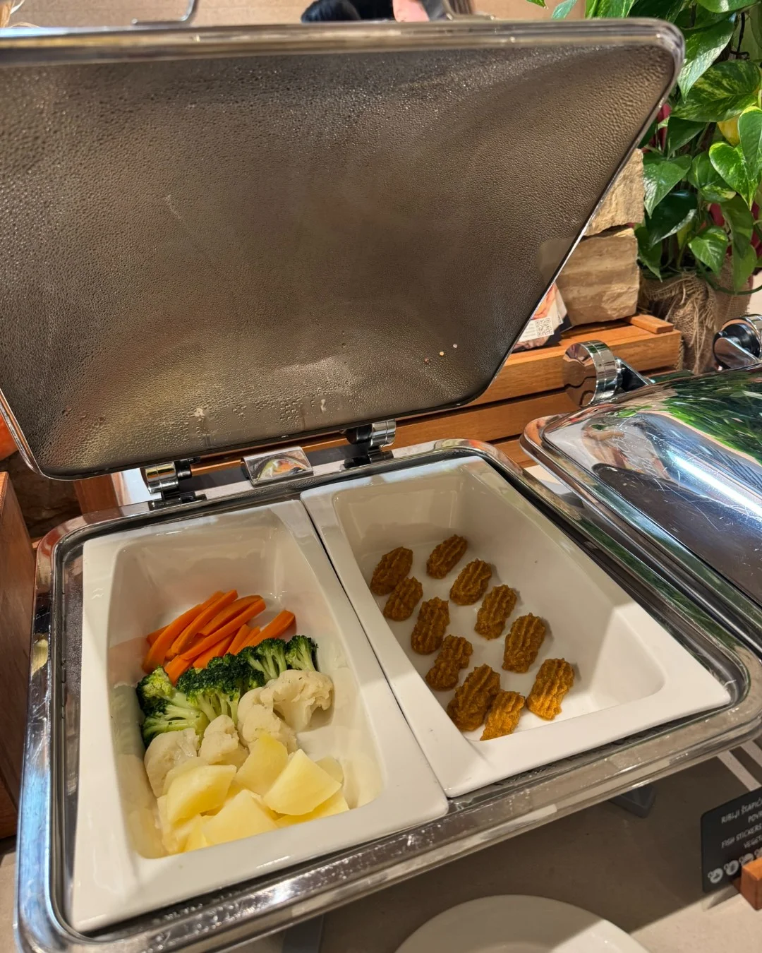 Soft-cooked pieces of vegetables and fish suitable for young children learning to feed themselves.