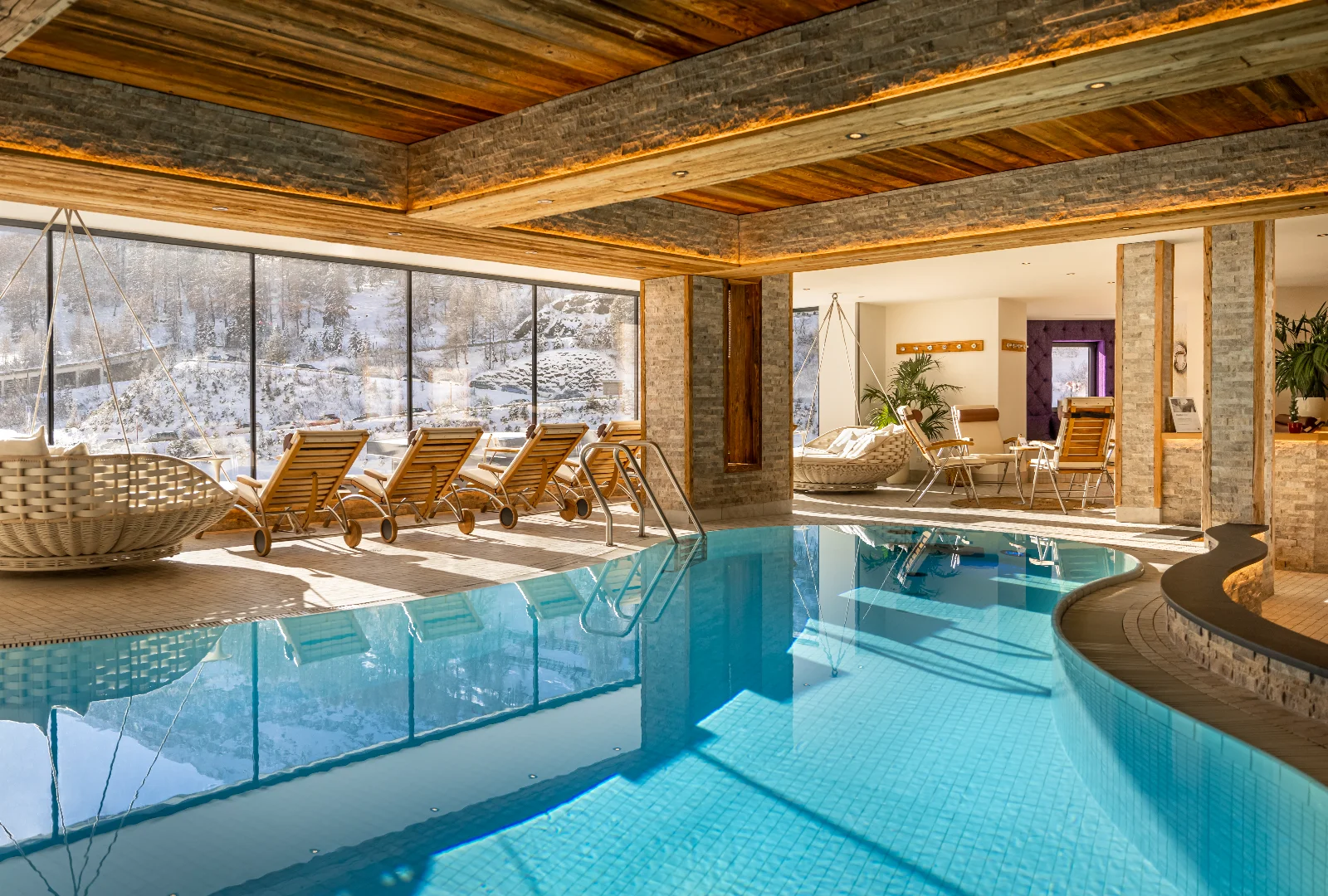 Indoor pool at Balance Spa in Kesselspitze Hotel, Valamar Collection, with snowy mountain views.