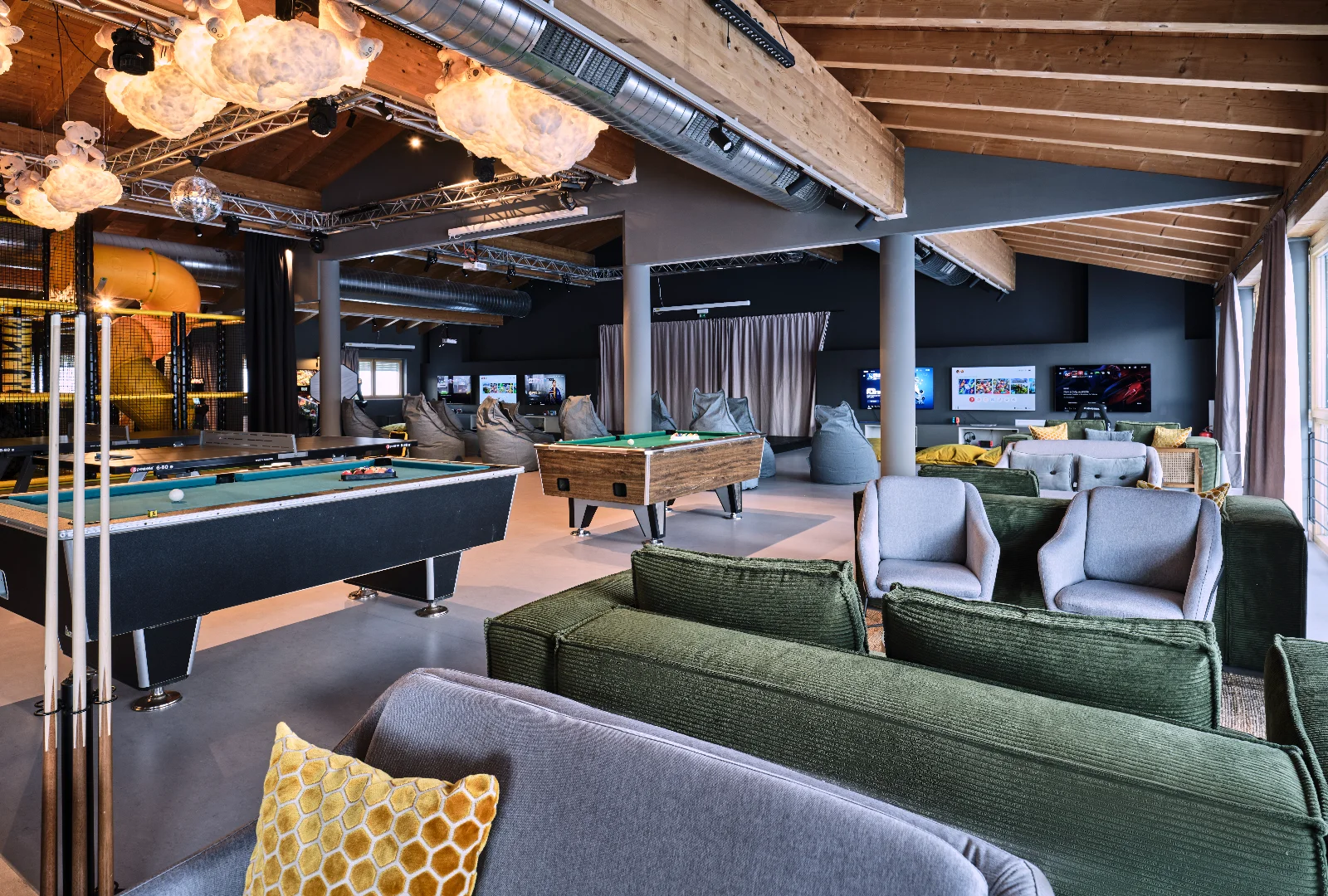Indoor entertainment area at [PLACES] Obertauern by Valamar, with games and activities for guests of different ages.