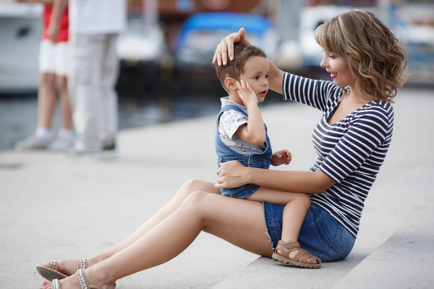 Parent crouching down to speak to their child at eye level.